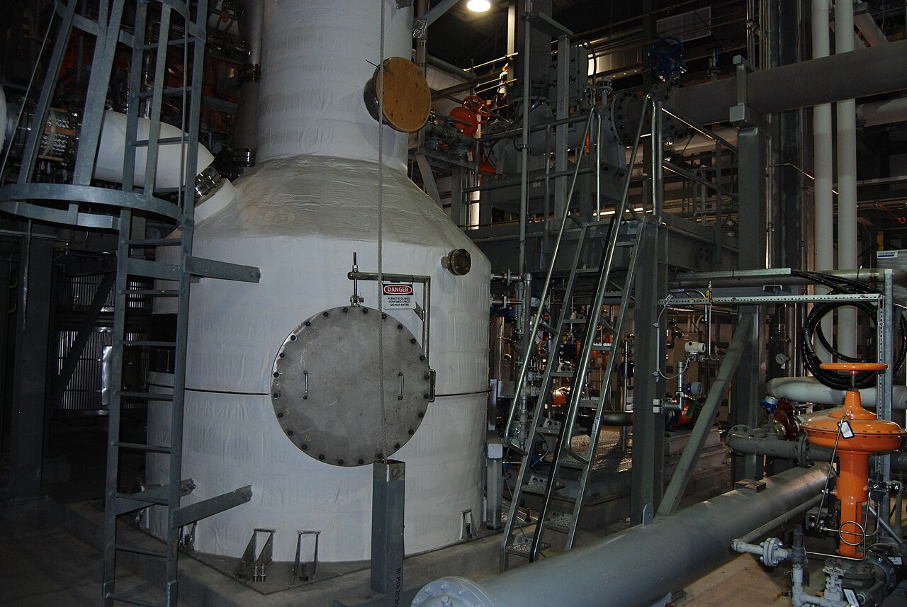Industrial packed-bed scrubber column in an operating off-gas treatment plant