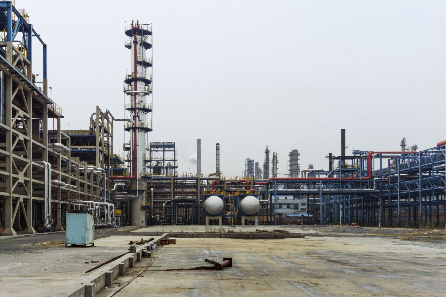 Ground level view of a syngas plant showing the flue gas stack, structures and pipe racks